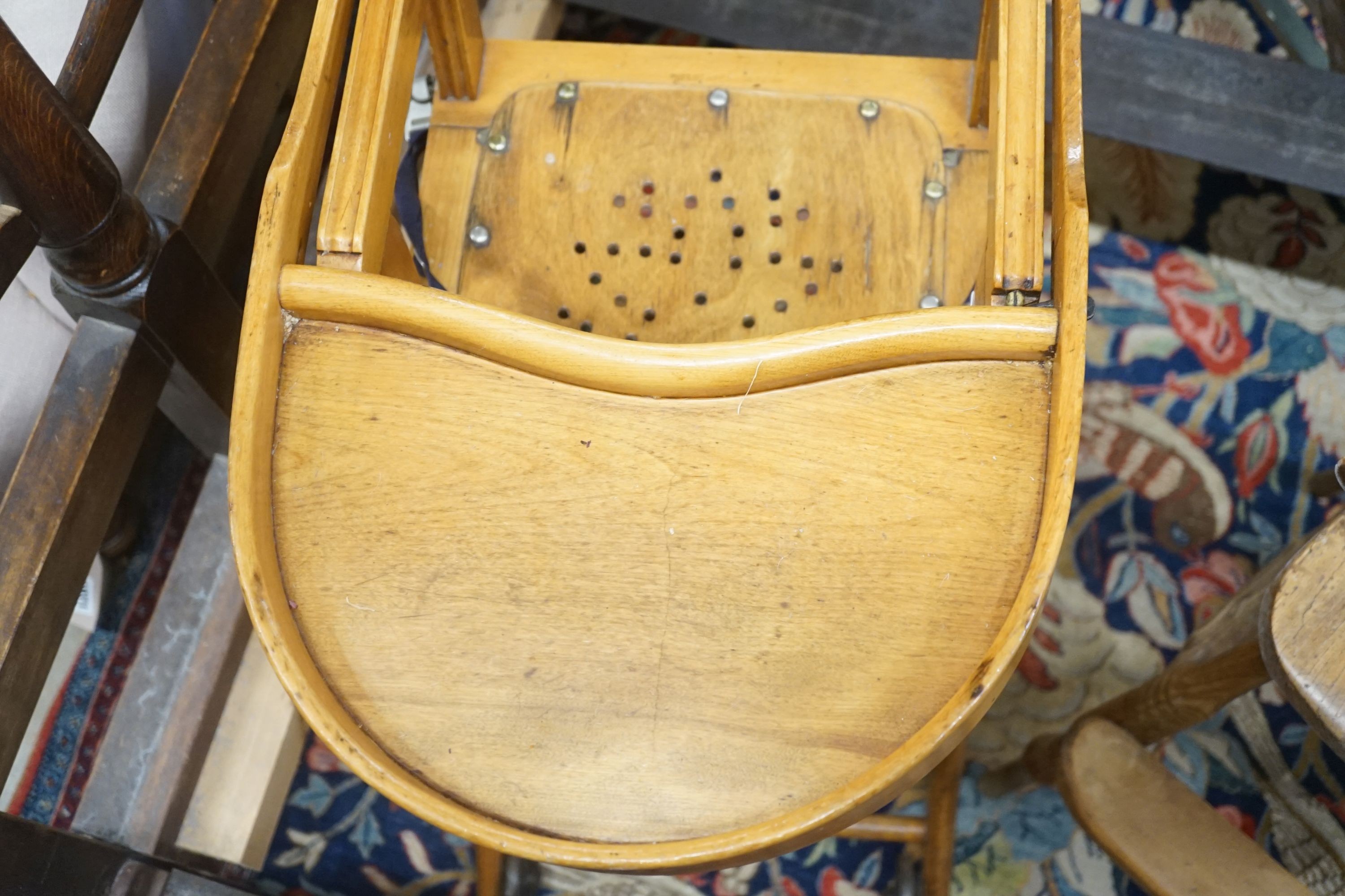 An early 20th century metamorphic child's high chair, together with a Victorian Windsor high chair